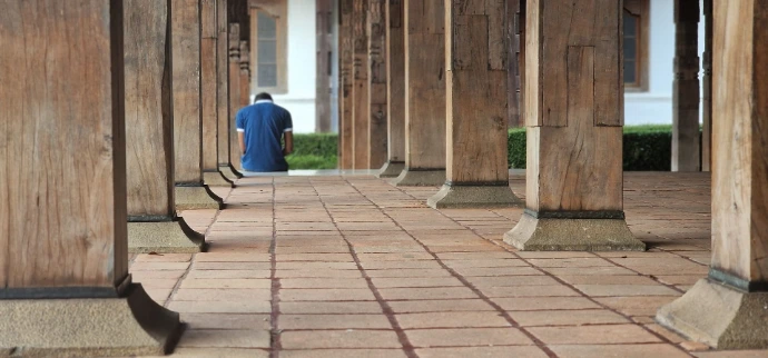 Perspective shot of ancient wooden pillars in Sri Lankan temple