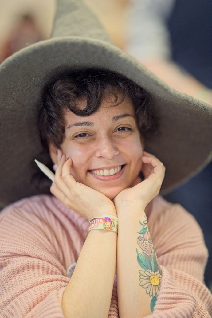 Portrait of woman in sun hat smiling at camera
