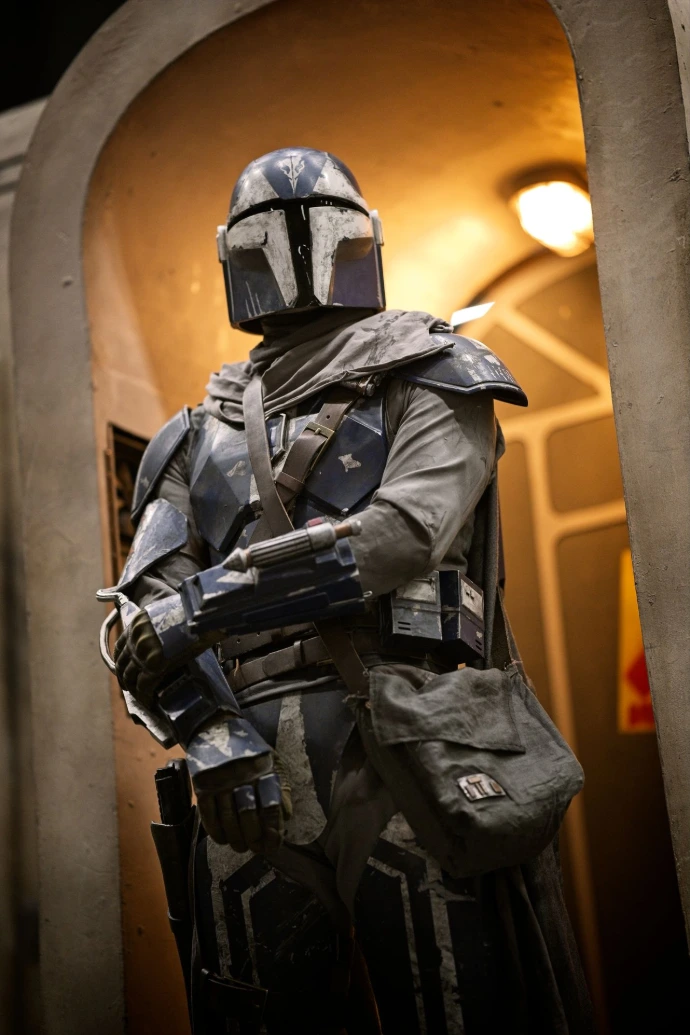 Cosplayer in full Mandalorian armor at convention