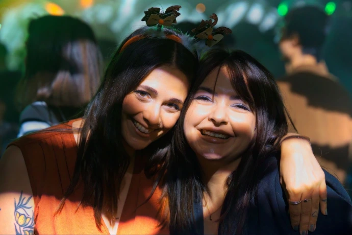 Two women taking a selfie together at a party