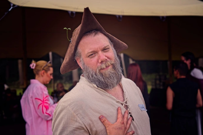 Man in medieval costume laughing at outdoor festival