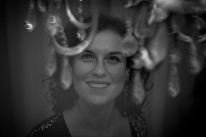 Black and white artistic portrait of woman smiling