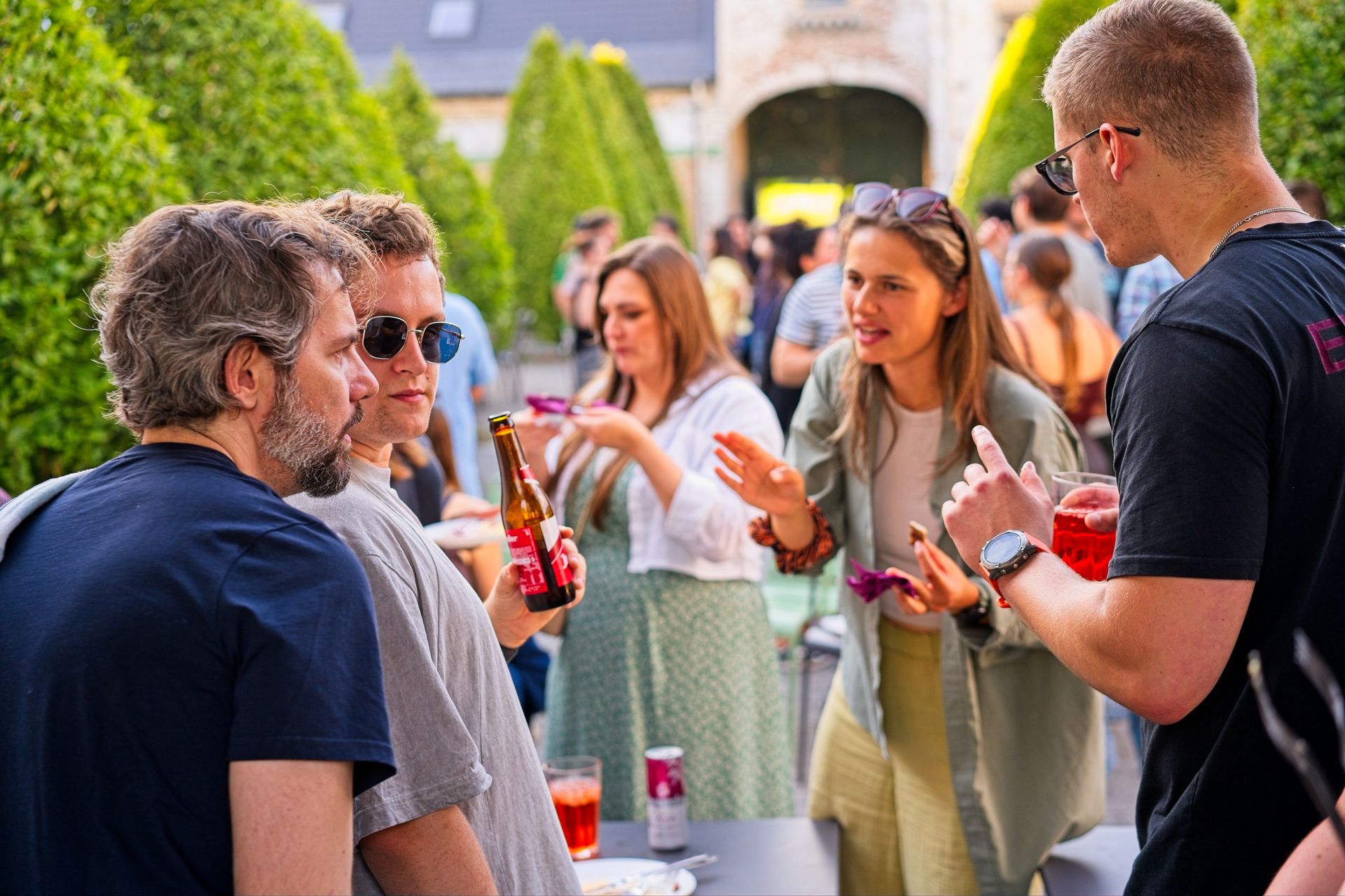 Guests laughing and drinking at corporate outdoor event