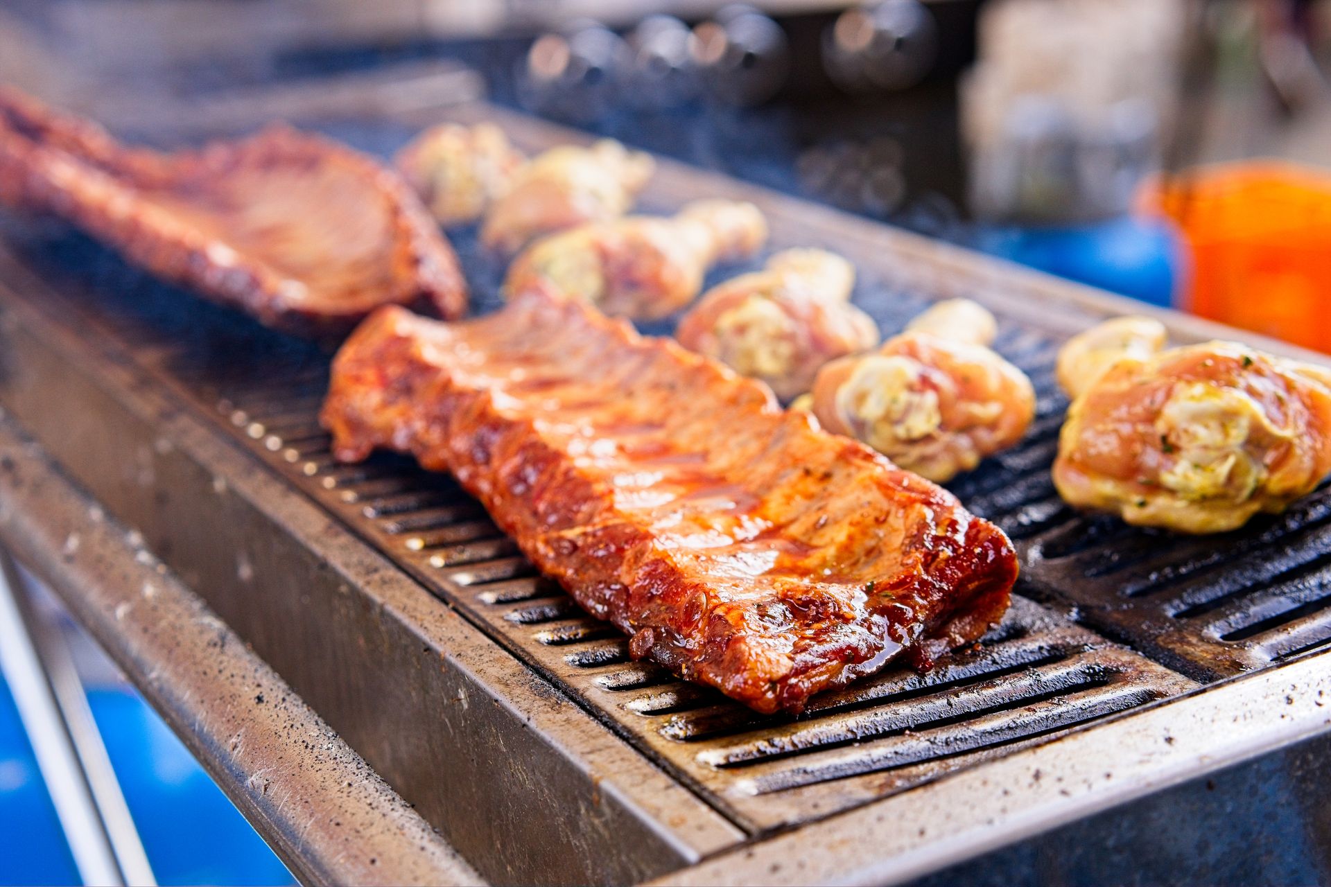 Close up of BBQ ribs cooking on grill